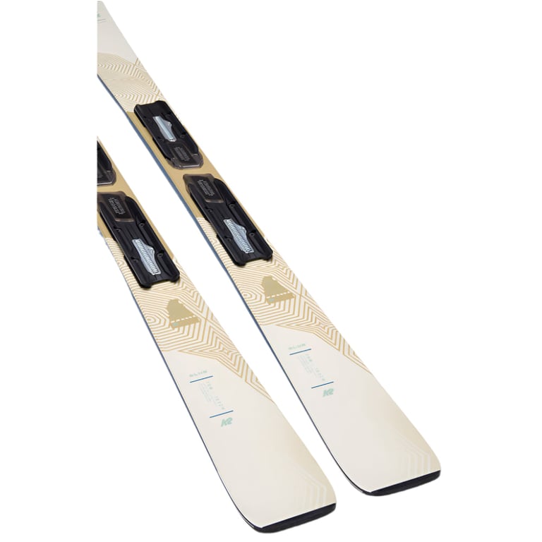 K2 Blur 76 women's skis with black bindings, cream and tan geometric graphics, shown at a diagonal angle.