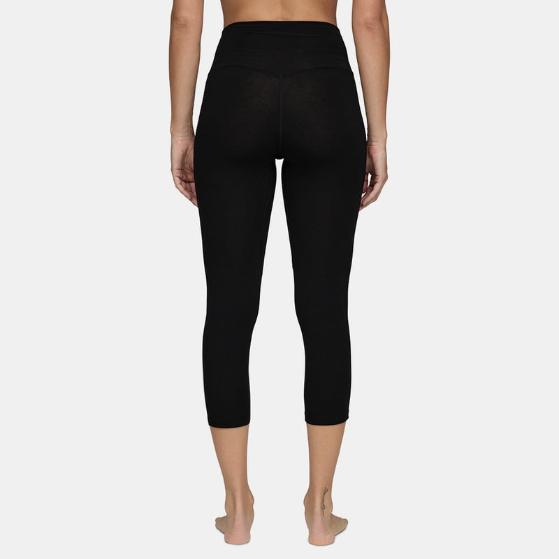 Woman wearing Le Bent Core Lightweight Thermal 3/4 Bottom back view