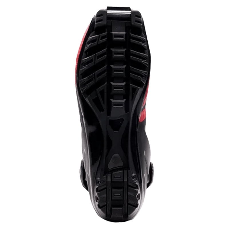 Bottom view of the black textured outsole and metal binding bar on a Madshus Pulse Boa Skate Boot with red accents.