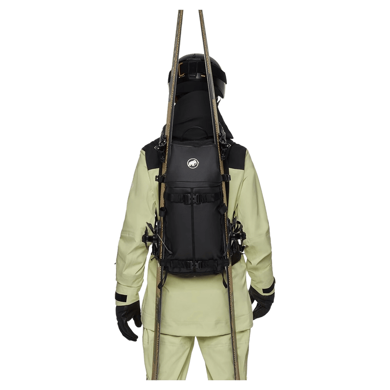 Carried view of the mmmut Nirvana 22L Backpack in Black colourway, unisex model