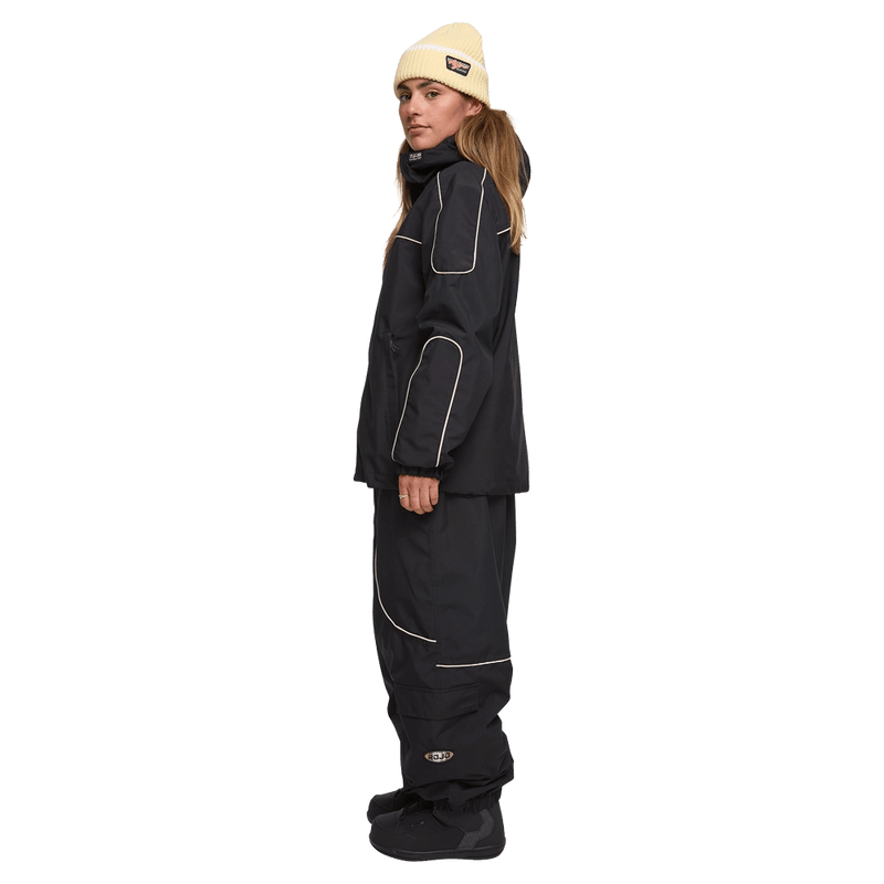 Side view of woman wearing the Rojo Nine Oh Ski Jacket - Womens in True Black