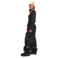 Side view of women wearing the Rojo Nine Oh Ski Pants - Womens in True Black.