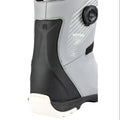 Close-up of a grey Nitro Club Boa snowboard boot showing the side Boa dial, black heel support, and white sole.