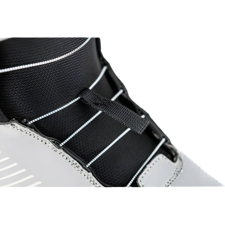 Close-up of Nitro Club Boa snowboard boot showing white lacing cables, black mesh tongue, and grey outer shell.