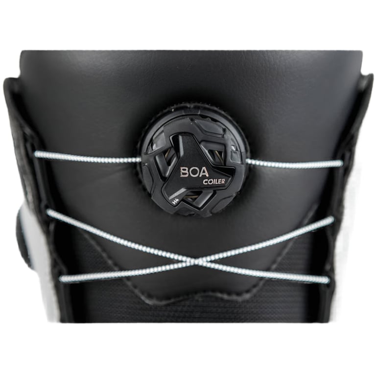 Close-up of the black Boa Coiler dial and silver wire lacing system on a Nitro Club Boa snowboard boot.