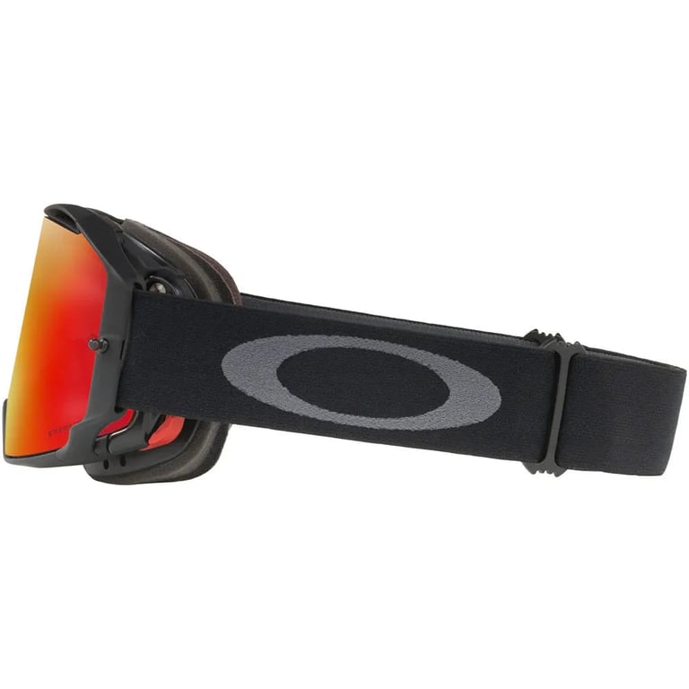 Side profile of Oakley Airbrake MTB goggles with black frame, red mirrored lens, and grey logo on a black elastic strap.