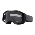 Oakley Airbrake MTB Goggle with carbon fiber pattern frame, dark smoke lens, and grey strap with logo.