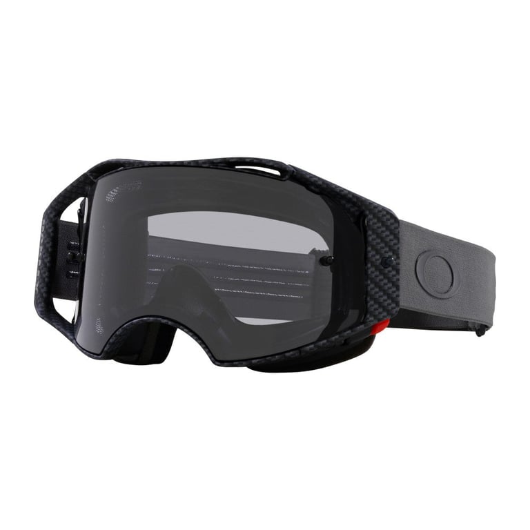 Oakley Airbrake MTB Goggle with carbon fiber pattern frame, dark smoke lens, and grey strap with logo.