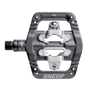 Grey One Up Components clip-in mountain bike pedal with silver metal mechanism and threaded spindle.