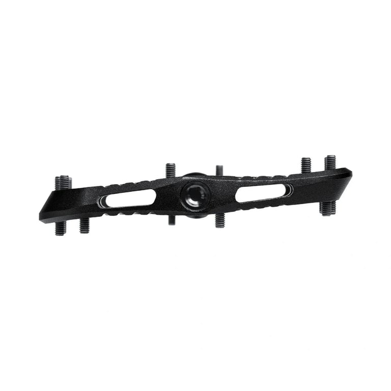 Side profile of a black One Up Components Wave mountain bike pedal with a thin wavy body and metal traction pins.