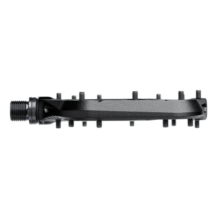 Side profile of a black One Up Components Wave mountain bike pedal with a slim platform and metal traction pins.