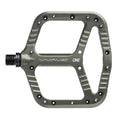 Grey One Up Components Wave flat mountain bike pedal with a large platform, ridged edges, and visible pin holes.