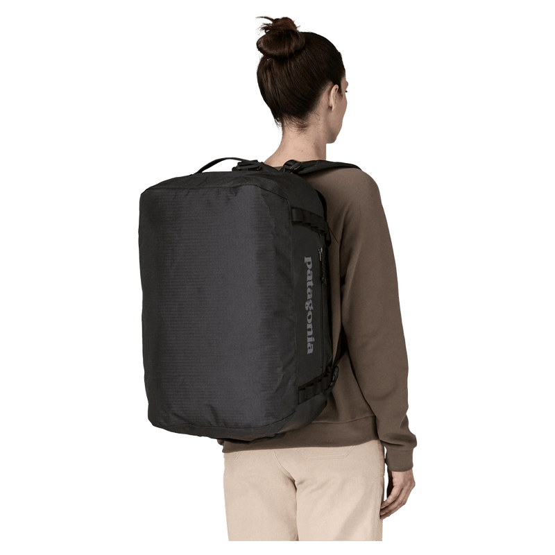 Carried view of the Patagonia Black_Hole_Duffel_40L_Black 49348 Bags,  26/27 Unisex's model
