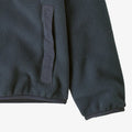 Pocket view of the Patagonia Synch Jacket - Kids_Smolder Blue 65320BKPL Fashion,  26/27 Unisex's model