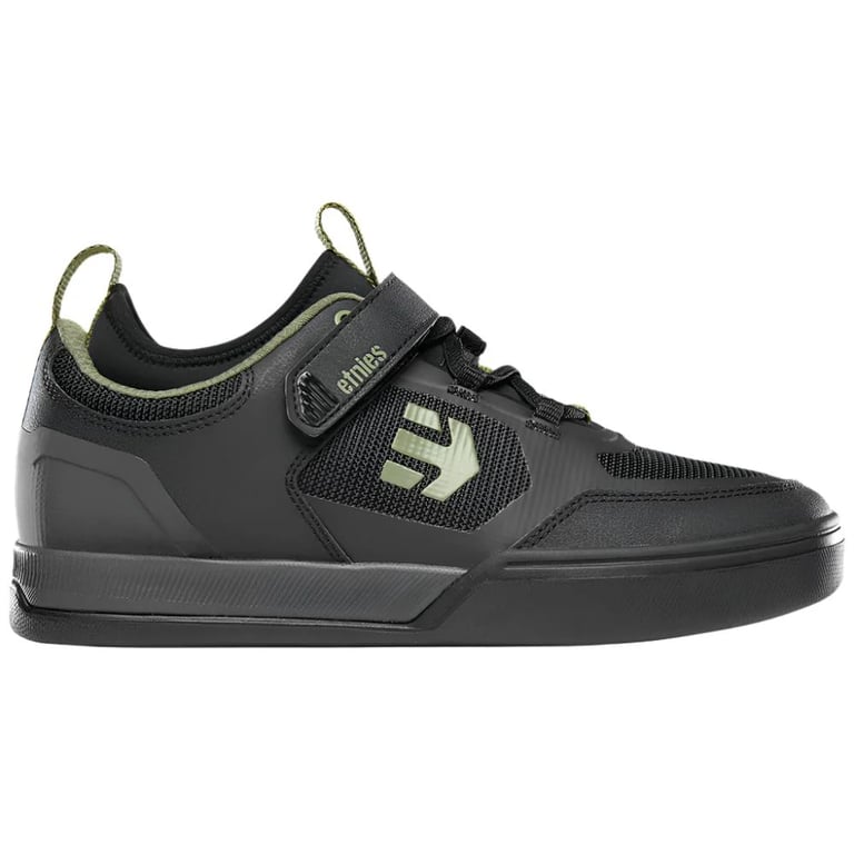 Black Etnies Camber CL mountain bike shoe with olive green logo, velcro strap, and mesh upper in a side profile view.