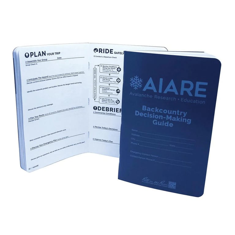 View of the cover and internal pages of the Decision Making Guide Field Book from BCA featuring a dark blue cover with light blue text.