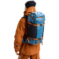 In action view of the Burton AK Dispatcher Backcountry Backpack in Blue Teal colourway, unisex's model