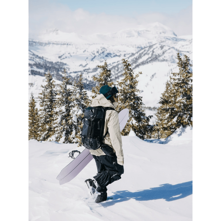 In action  view of the Burton AK Dispatcher Backcountry Backpack in True Black colourway, unisex's model