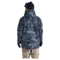 Quiksilver Mission Printed Snowboard Jacket in dark blue topographic print with hood and chest logo on a model.