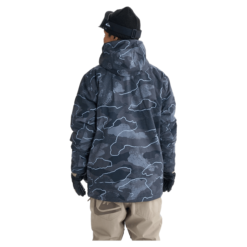 Quiksilver Mission Printed Snowboard Jacket in dark blue topographic print with hood and chest logo on a model.