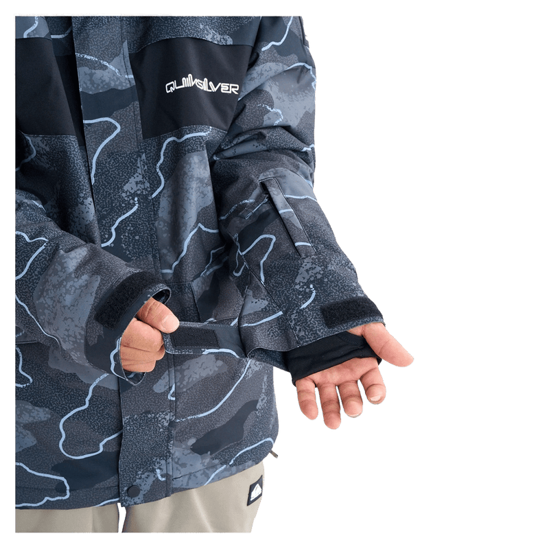 Quiksilver Mission Printed Snowboard Jacket in dark blue topographic print with hood and chest logo on a model.