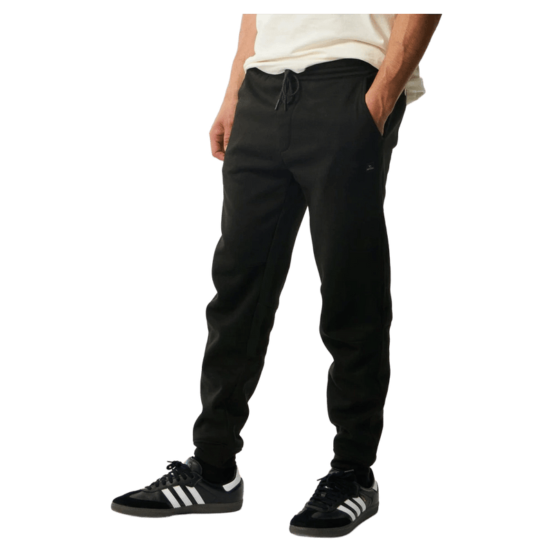 Black Rip Curl Anti Series Departed Trackpants with drawstring waist, side pockets, and cuffed ankles.