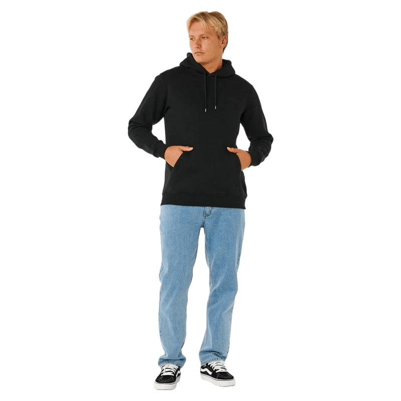 Black Rip Curl Classic Surf Hoodie with kangaroo pocket and drawstrings worn by a man in light blue jeans.