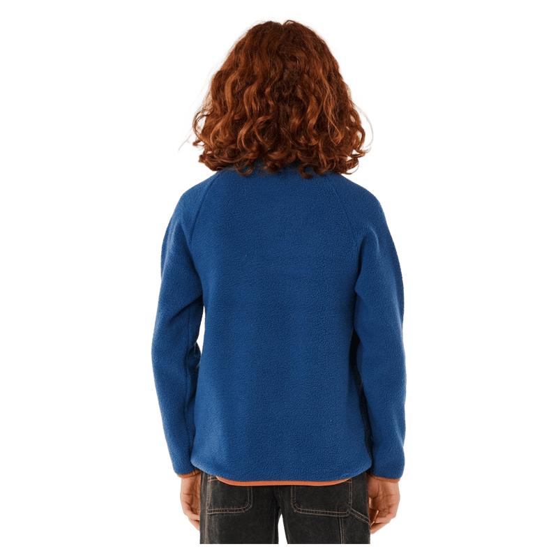 Back view of a blue Rip Curl Heritage Polar Fleece for kids with orange trim and raglan sleeves.