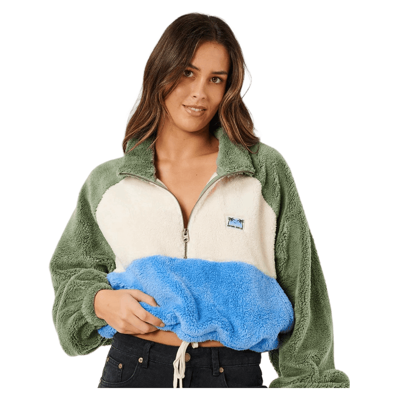 Rip Curl Hotel Malibu polar fleece in green, cream, and blue with a half-zip, high collar, and fuzzy texture.