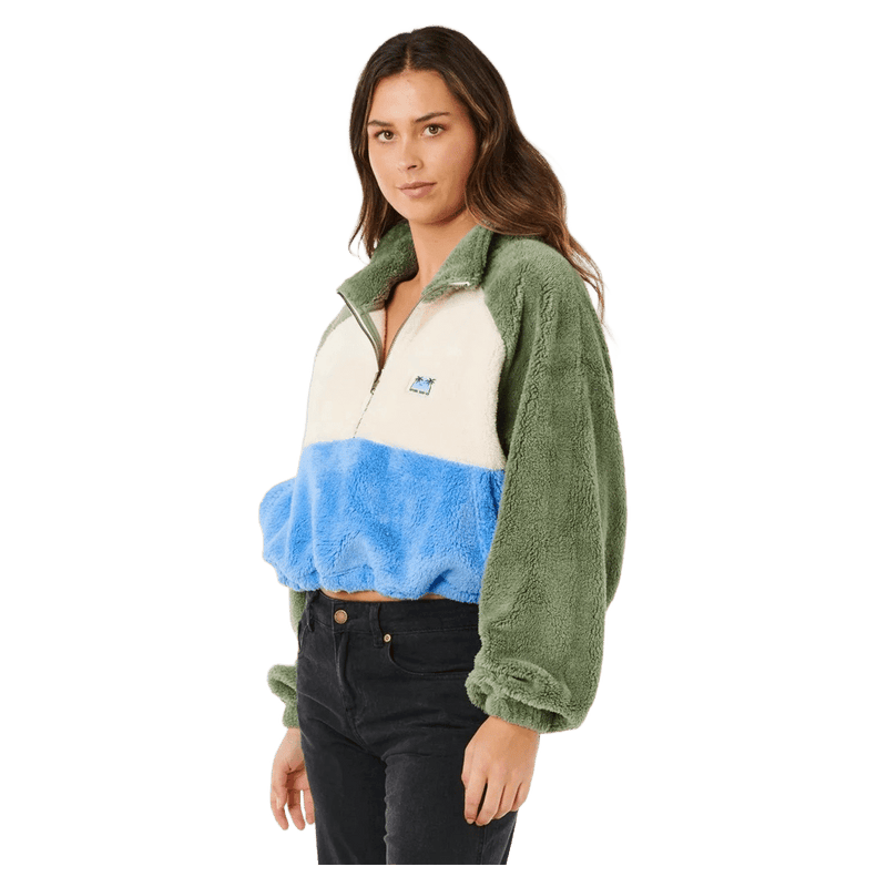 Rip Curl Hotel Malibu women's fuzzy polar fleece with green sleeves, cream and blue panels, and a quarter-zip collar.