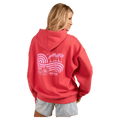 Back view of a coral pink Rip Curl hoodie featuring a pink wave and palm tree graphic on the back.