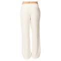Back view of Rip Curl Surf Puff wide leg trackpants in off-white with an elastic waistband.