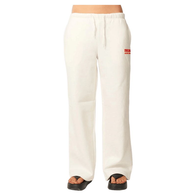 White Rip Curl wide-leg trackpants with a drawstring waist and a small red logo on the hip.