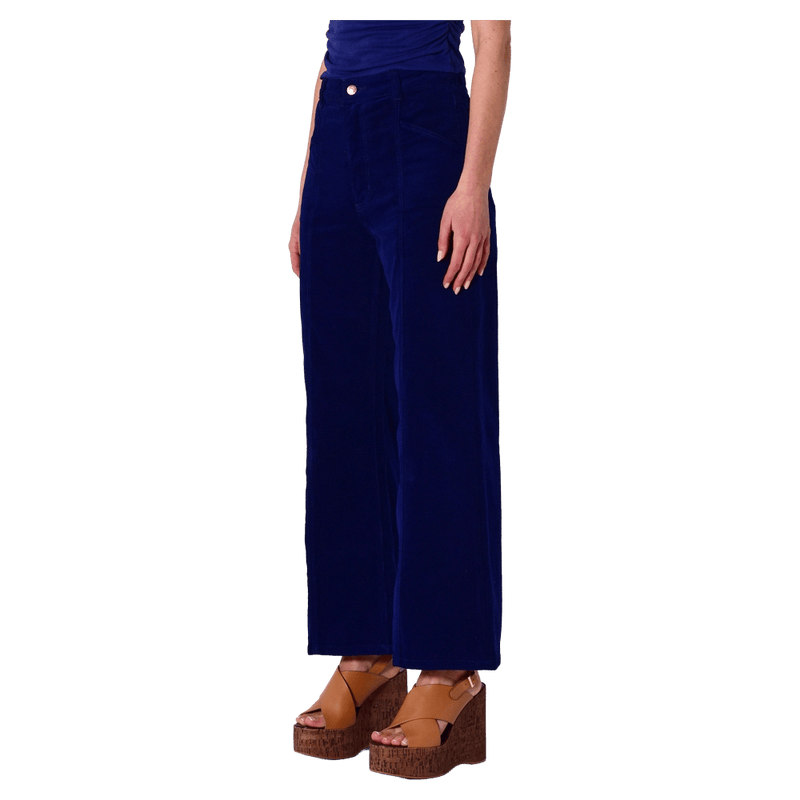 Side view of a women in the Sailor Deco Marine Cord Jeans in colour Marine
