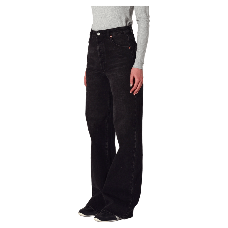 Side view of a women in  Sailor Scoop Long Jeans in colour Black Rock
