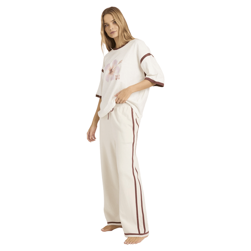 Side view of women wearing the Billabong Back To It Trackpants - Womens in Salt Crystal