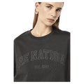 Close view of the PE NATION Core Oversized Tee Caviar Tee,  26/27 Womens's model