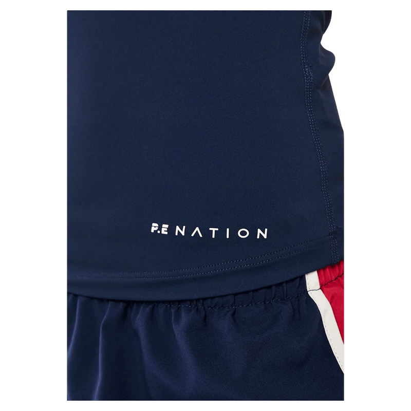 Logo view of the PE NATION Foundation Muscle Tank Dark Navy Tops,  26/27 Womens's model