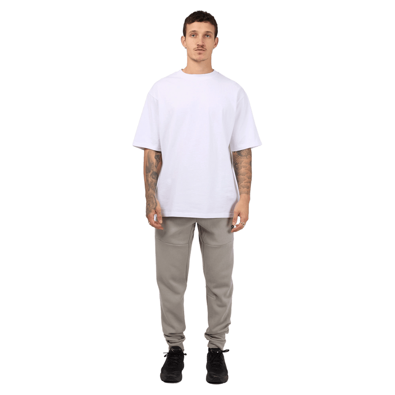 Full-body view of the St. Goliath Tech Track Pants in Grey colourway, men's model