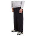 Side view of man wearing the Billabong Adiv Slant Pants in Black