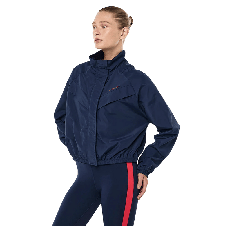 Side view of the PE NATION Shield Dark Navy Jacket,  26/27 Womens's model