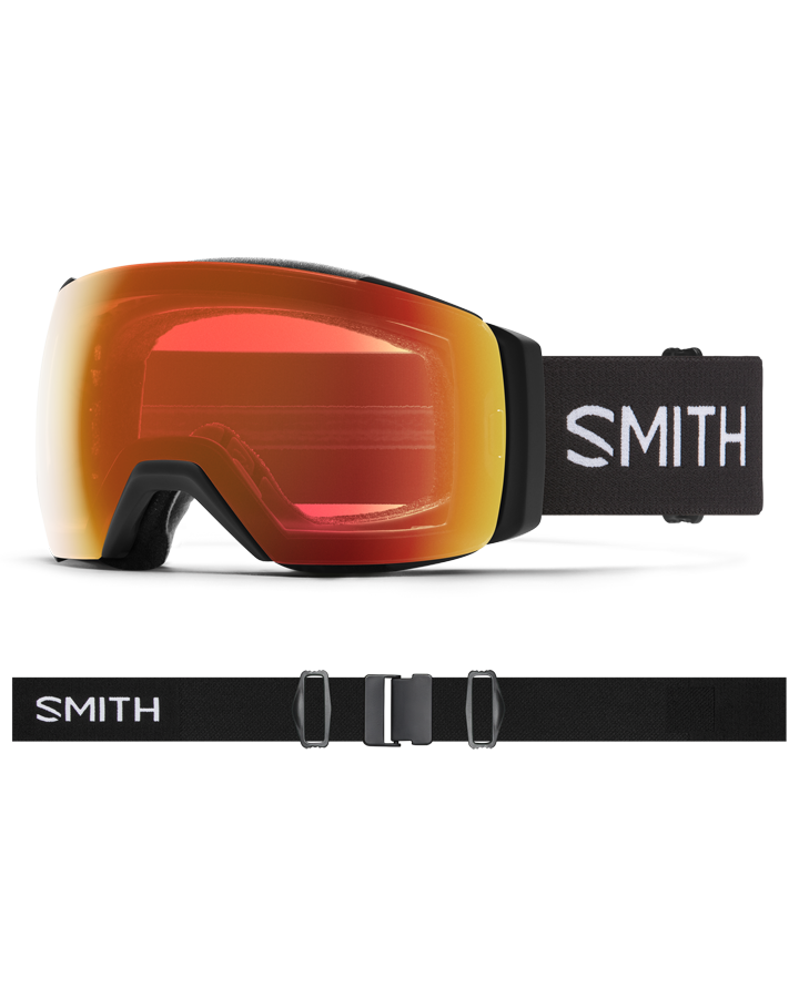 Smith I/O Mag XL snow goggles with red-orange mirrored lens, black frame, and adjustable black strap with white logo.
