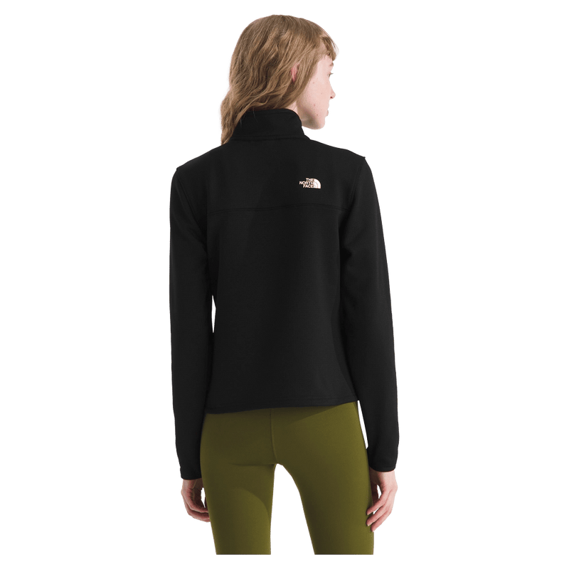 Rear view of a woman wearing The North Face Cedar Trail Grid Fleece ¼ Zip Jacket for Women in Black