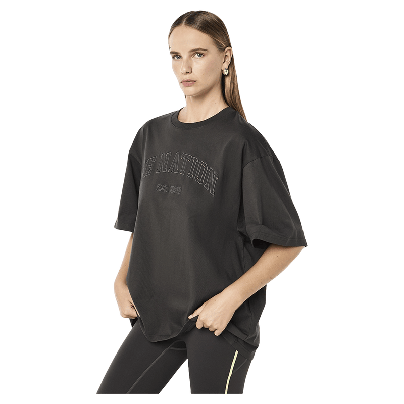 Side view of the PE NATION Core Oversized Tee Caviar Tee,  26/27 Womens's model