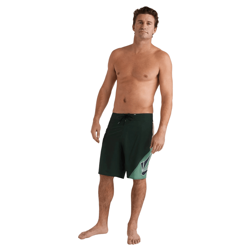 Full-body view of the Volcom Vee Bee Mod Short in Scarab colourway, men's model