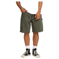Front cropped view of a man wearing the Bad Dog Workwear Shorts from Billabong in Dark Military.