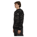 Side view of man wearing the Billabong Immortal Sweater in Black