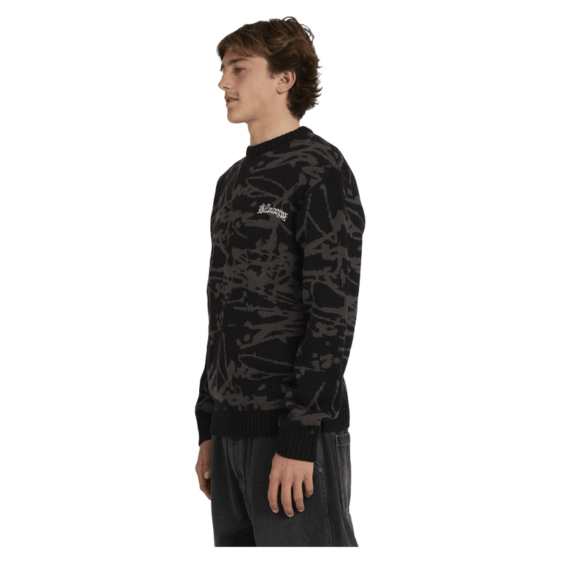 Side view of man wearing the Billabong Immortal Sweater in Black