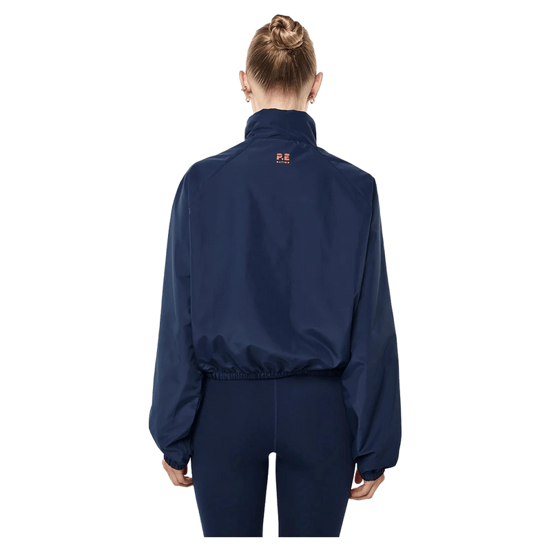 Back view of the PE NATION Shield Dark Navy Jacket,  26/27 Womens's model