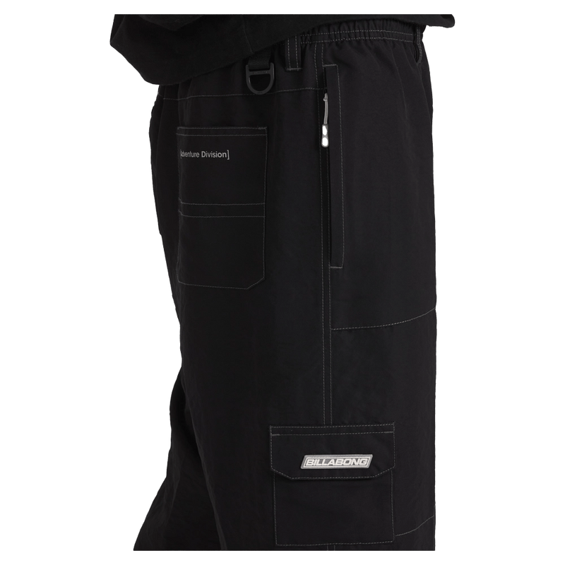 Side view of man wearing the Billabong Adiv Slant Pants in Black